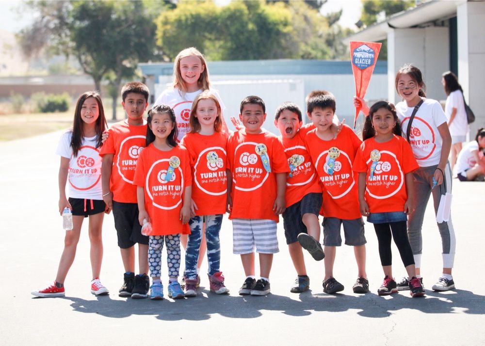 A Fremont elementary school fundraiser — kids in matching bright orange tees